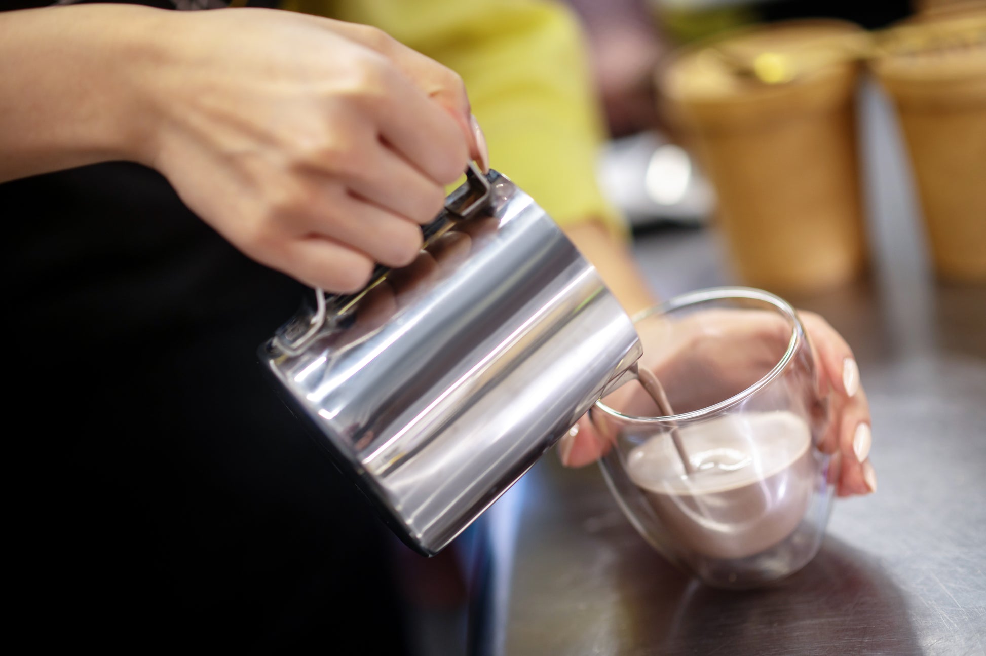 hands-pouring-cocoa-close-up